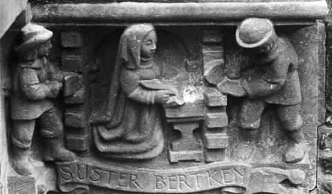 Suster Bertken, die haar gedichten schrijft, terwijl zij wordt ingemetseld